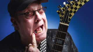 Rick Nielsen giving the finger while holding a guitar
