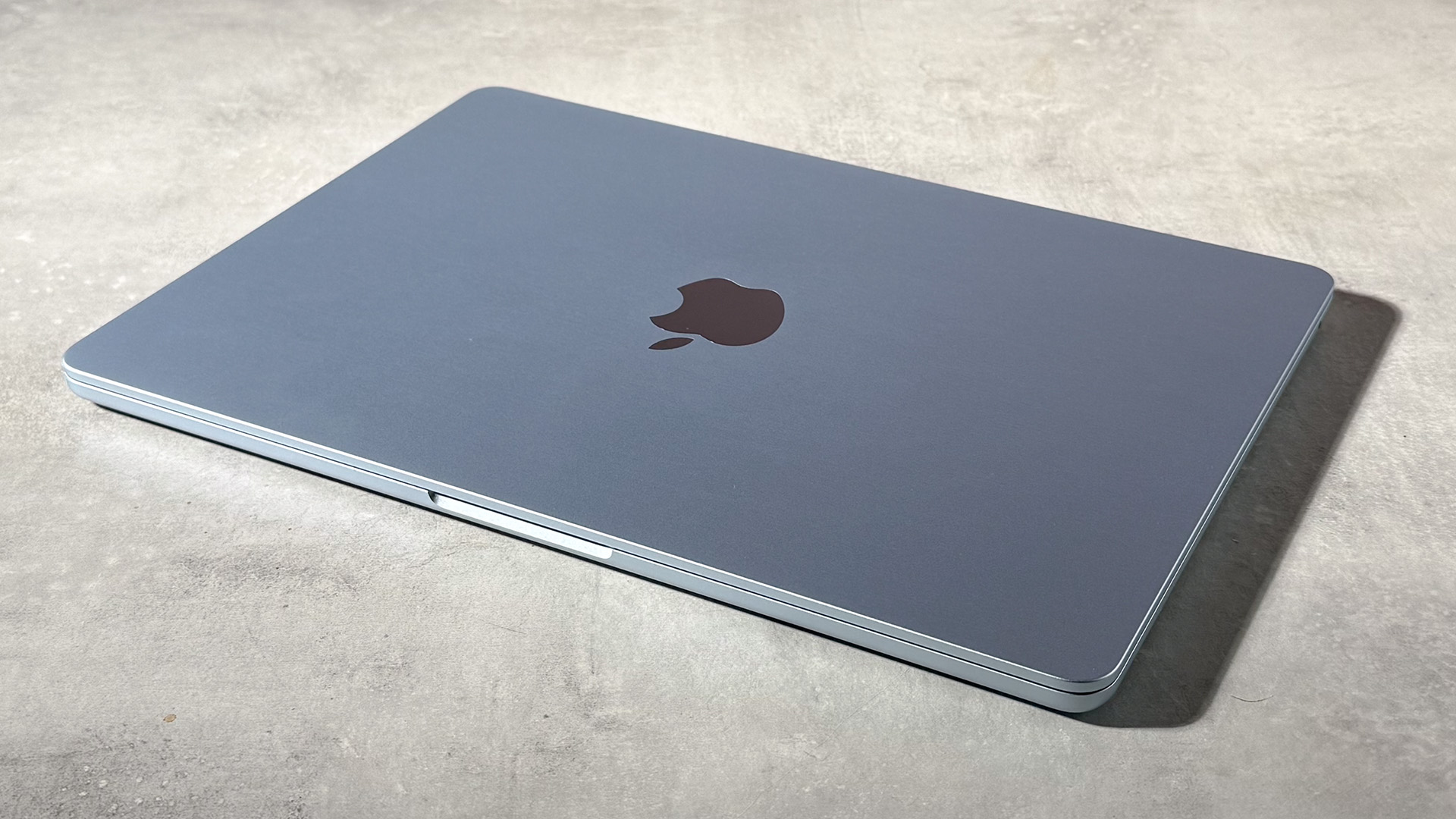 The MacBook Air M5 sky blue with a closed lid.