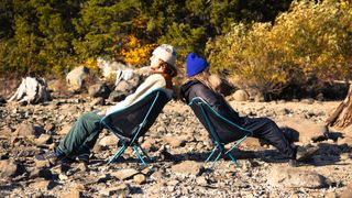 Campers at the beach sitting in Helinox Chair One (re) camping chairs