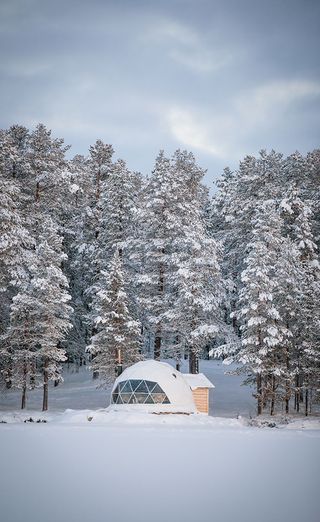 Igloo hotels in Finland covered with ice and snow