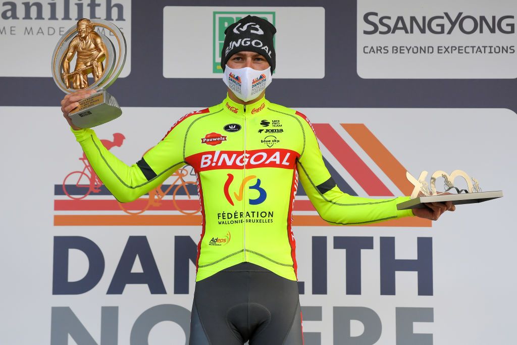 NOKERE BELGIUM MARCH 17 Podium Ludovic Robeet of Belgium and Team Bingoal WB Celebration during the 75th Nokere Koerse Danilith Classic 2021 Mens Elite a 1955km race from Deinze to Nokere Mask Covid safety measures Trophy NokereKoerse on March 17 2021 in Nokere Belgium Photo by Luc ClaessenGetty Images