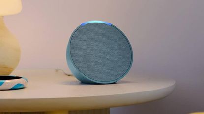 Close up on the new Echo Pop smart speaker sat on a table