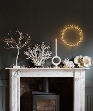 Christmas mantlepiece styling in snowy whites with illuminated wreath