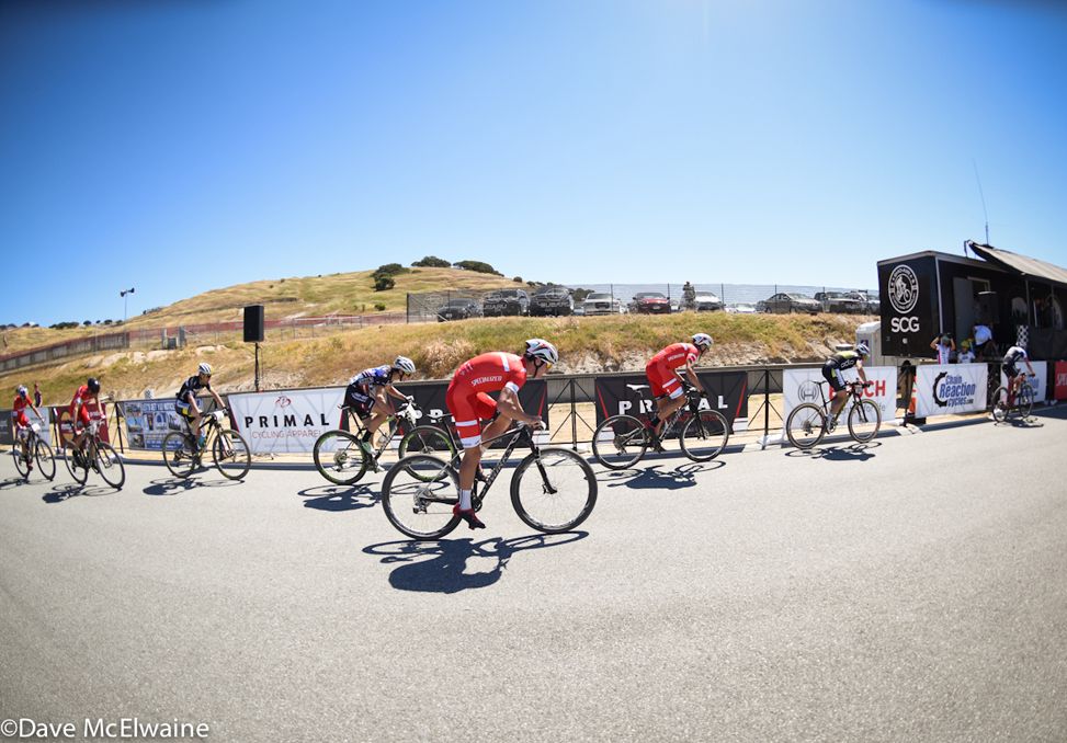 The leaders pass through the start-finish area with one lap to go