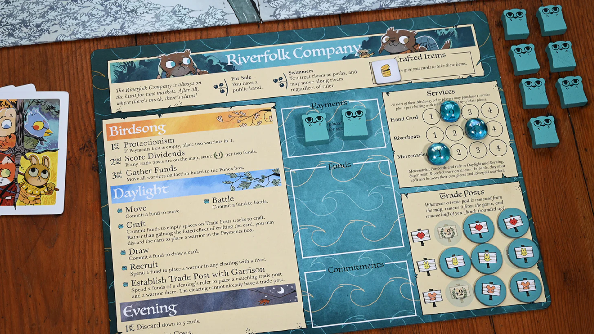 Root Riverfolk expansion board and tokens on a wooden surface