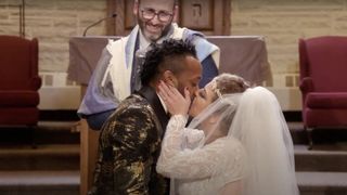 Bini kissing Ari on their wedding day in 90 Day Fiance