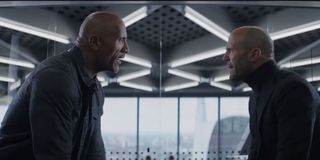 Dwayne Johnson and Jason Statham staring each other down in Hobbs & Shaw