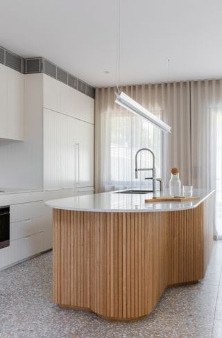 a curved kitchen island