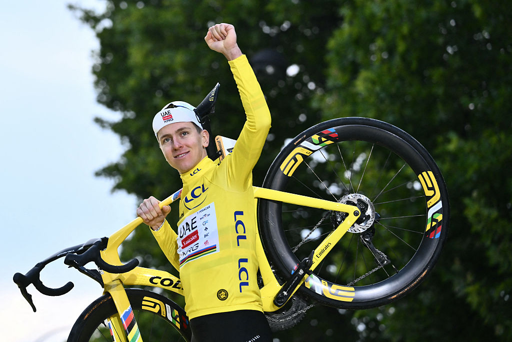 UAE Team Emirates - XRG team's Slovenian rider Tadej Pogacar celebrates on the podium with the overall leader's yellow jersey after the 21st and final stage of the 112th edition of the Tour de France cycling race, 132.3 km between Mantes-la-Ville and Paris Champs-&amp;Eacute;lysees, on July 27, 2025. (Photo by Marco BERTORELLO / AFP)