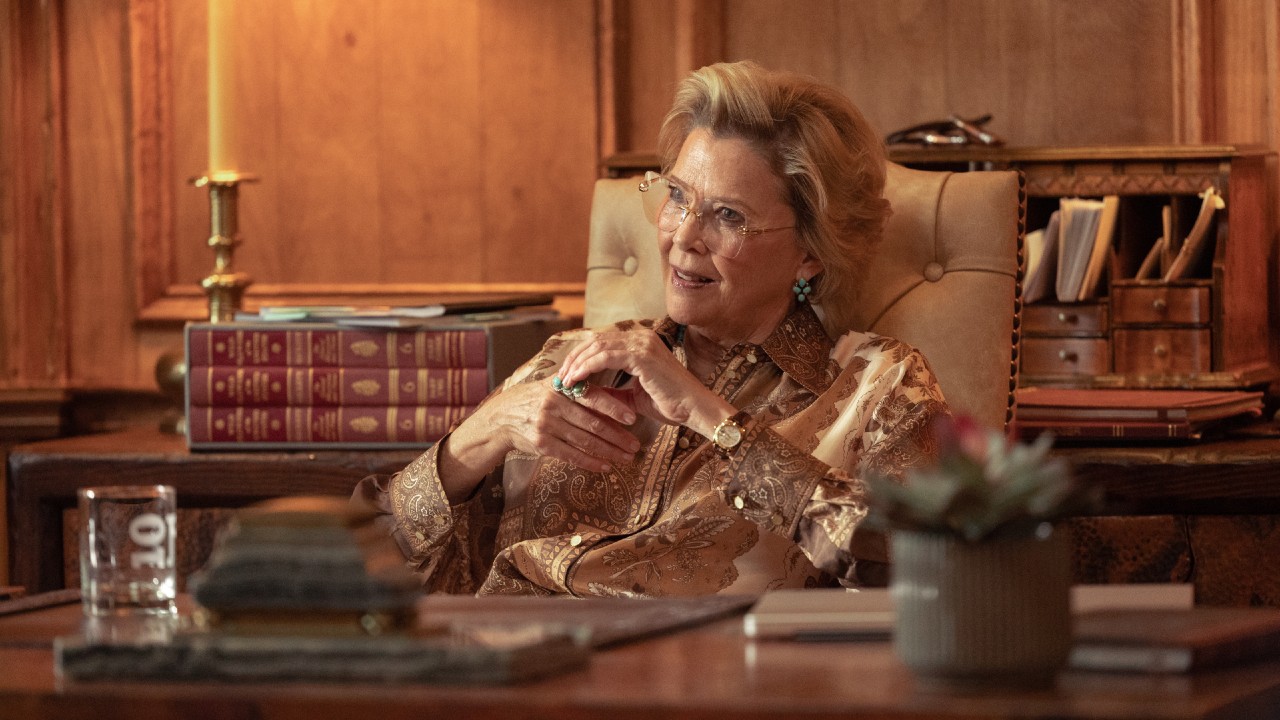Annette Bening as Beulah Jackson sitting behind a desk and playing with her rings on Dutton Ranch.