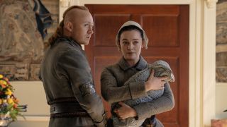 Ian and Rachel with their infant son waiting on news in Outlander Season 8x06