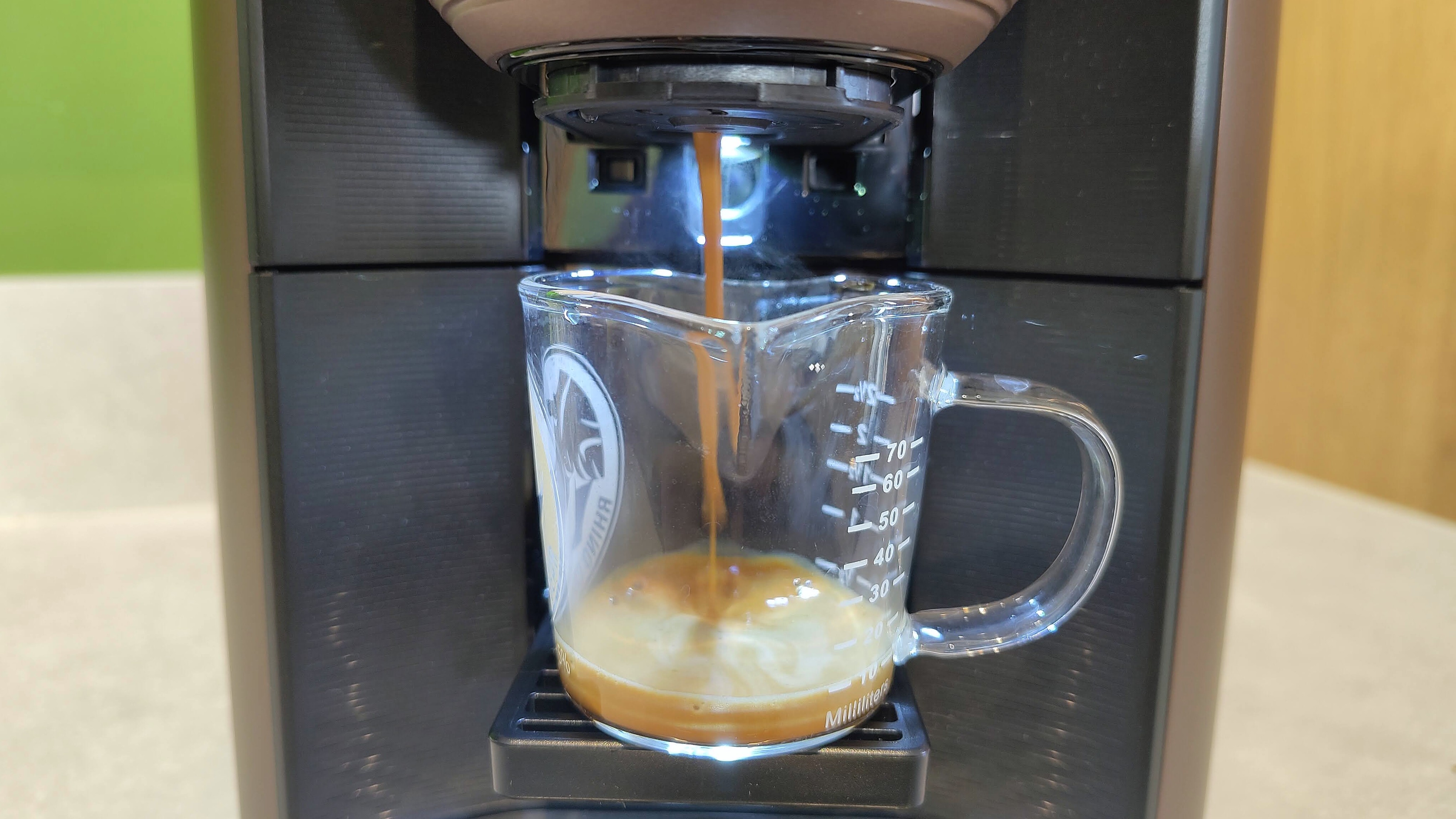 Lavazza Assoluta espresso machine dispensing espresso