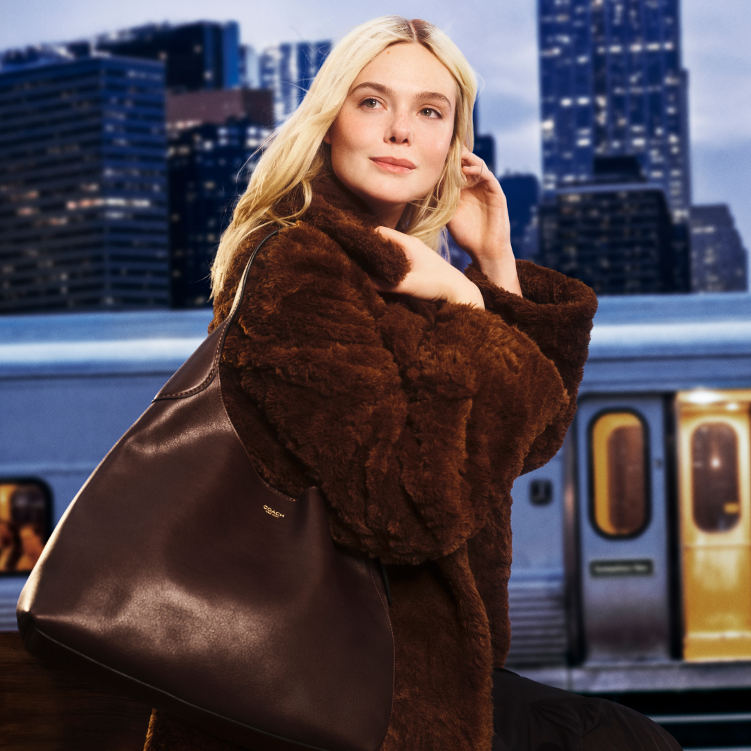 Elle Fanning wearing a Coach Teddy Coat and a Brooklyn Bag