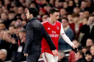 Mesut Ozil, right, has not played since March