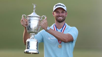 Wyndham Clark of the United States poses with the trophy after securing victory in the final round of the 123rd U.S. Open Championship.
