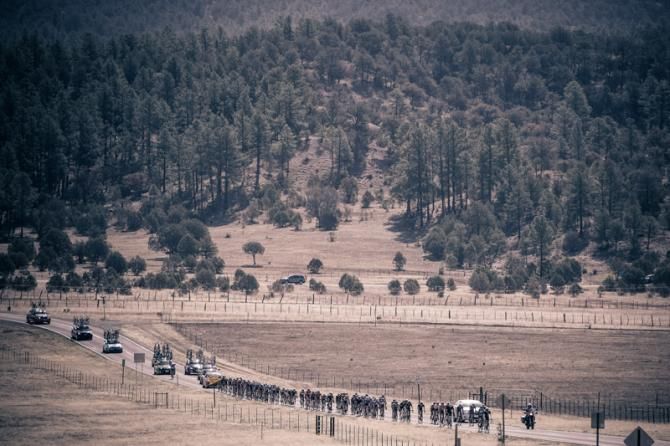 The peloton rolls through the wide open New Mexico countryside.
