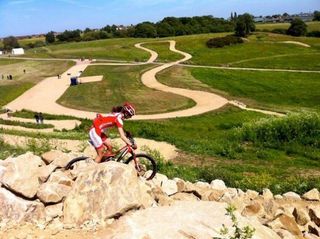 Lea Davison dials in the first descent on the Olympic mountain bike course