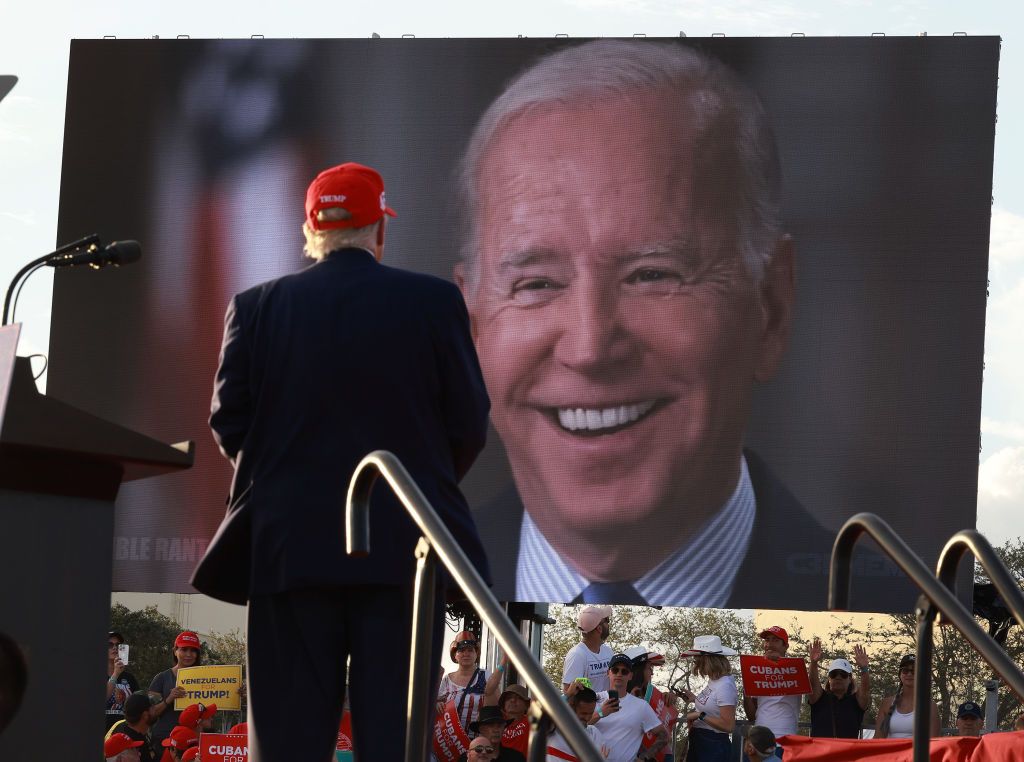 Donald Trump watches a video of President Joe Biden playing during a rally for Sen. Marco Rubio on Nov. 6, 2022