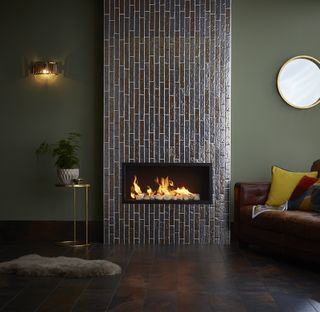 Green living room with tiled chimney breast