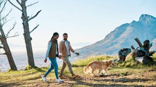 Couple hiking with dog