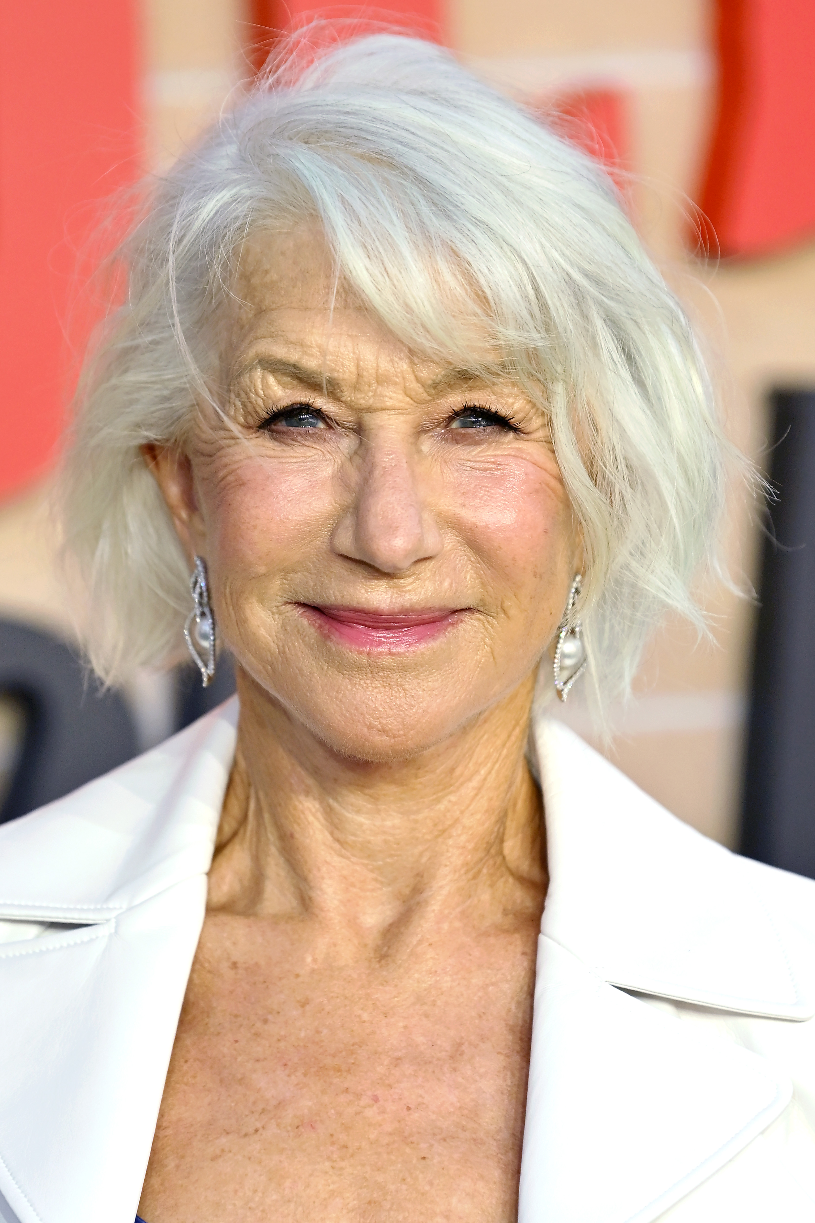 Dame Helen Mirren is pictured with a textured short bob hairstyle at&quot;The Thursday Murder Club&quot; UK Premiere at Leicester Square Gardens on August 21, 2025 in London, England.