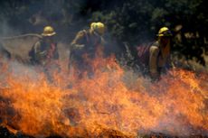 Firefighters tackle a controlled burn in CA