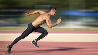 Man sprinting on a running track