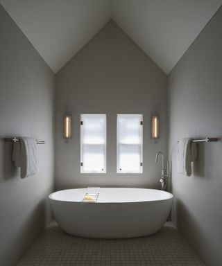 freestanding bath in grey bathroom