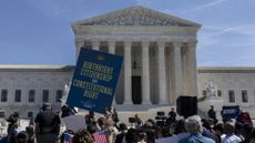 Protesters at the Supreme Court ahead of oral arguments on birthright citizenship.
