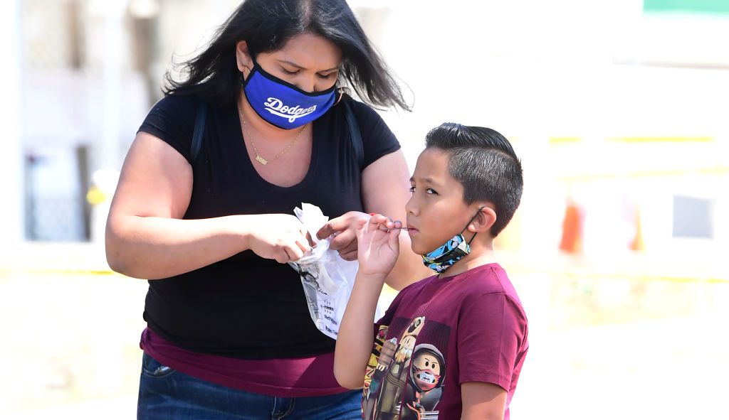 A child takes a COVID-19 test.