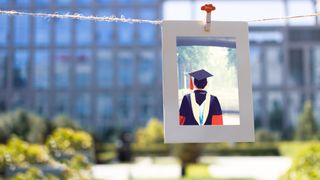 Graduation photo printed and pegged onto twine.