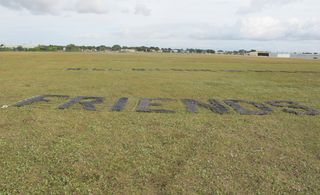 Martin Creed's banner, laid out on the airstrip.