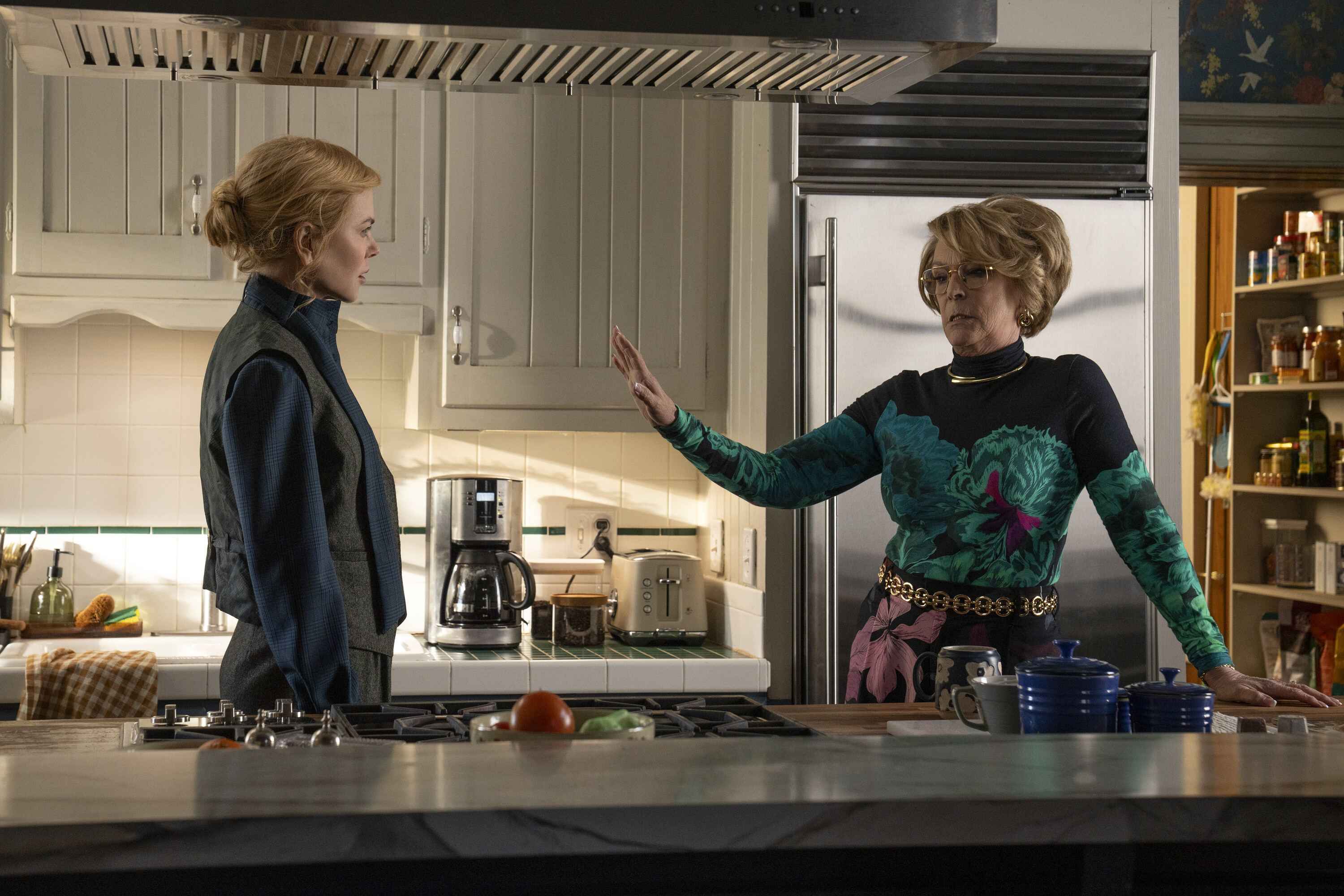 Kay Scarpetta (Nicole Kidman) and Dorothy Farinelli (Jamie Lee Curtis) have a tense conversation in a kitchen in a still from scarpetta