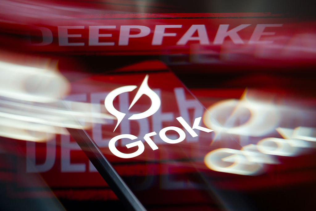The Grok AI logo is displayed on a smartphone screen in this photo illustration(Photo Illustration by Jonathan Raa/NurPhoto)