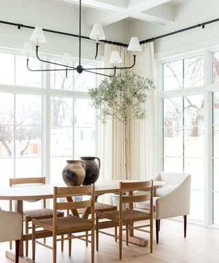 White dining room with large windows