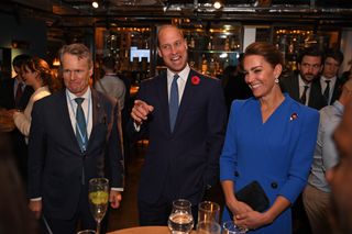 Catherine, Duchess of Cambridge (L) and Prince William, Duke of Cambridge (R) speak with guests at a reception for the key members of the Sustainable Markets Initiative and the Winners and Finalists of the first Earthshot Prize Awards
