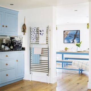 Kitchen with white walls and wooden flooring