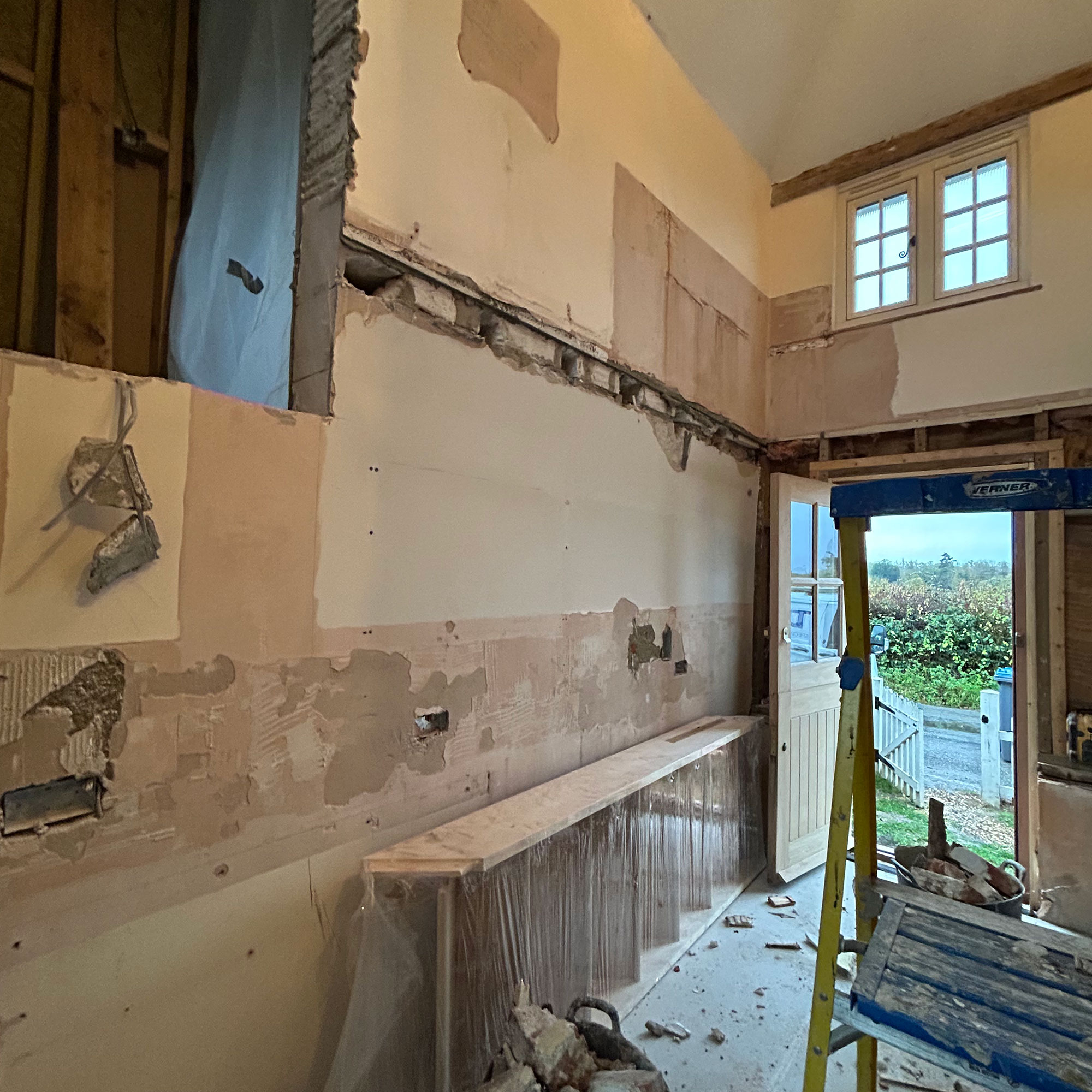 A double height entrance hall mid-renovation