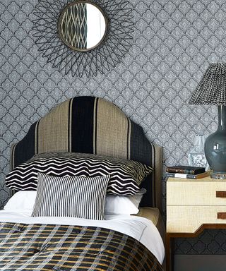 Single bed, black and grey headboard, gold and black check duvet