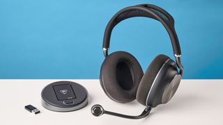 The Turtle Beach Stealth Pro II next to its base station and 2.4G dongle
