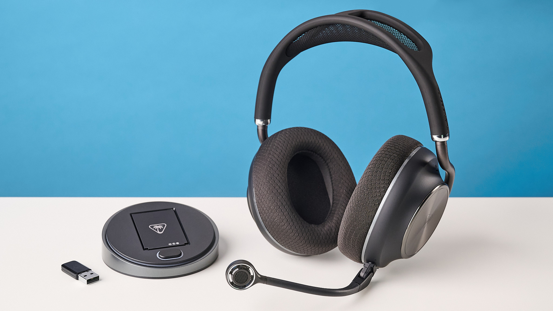 The Turtle Beach Stealth Pro II next to its base station and 2.4G dongle
