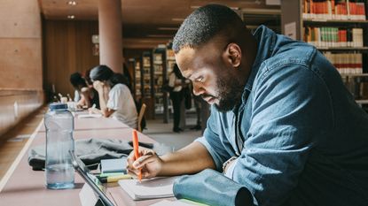 A college student studies in a university library.