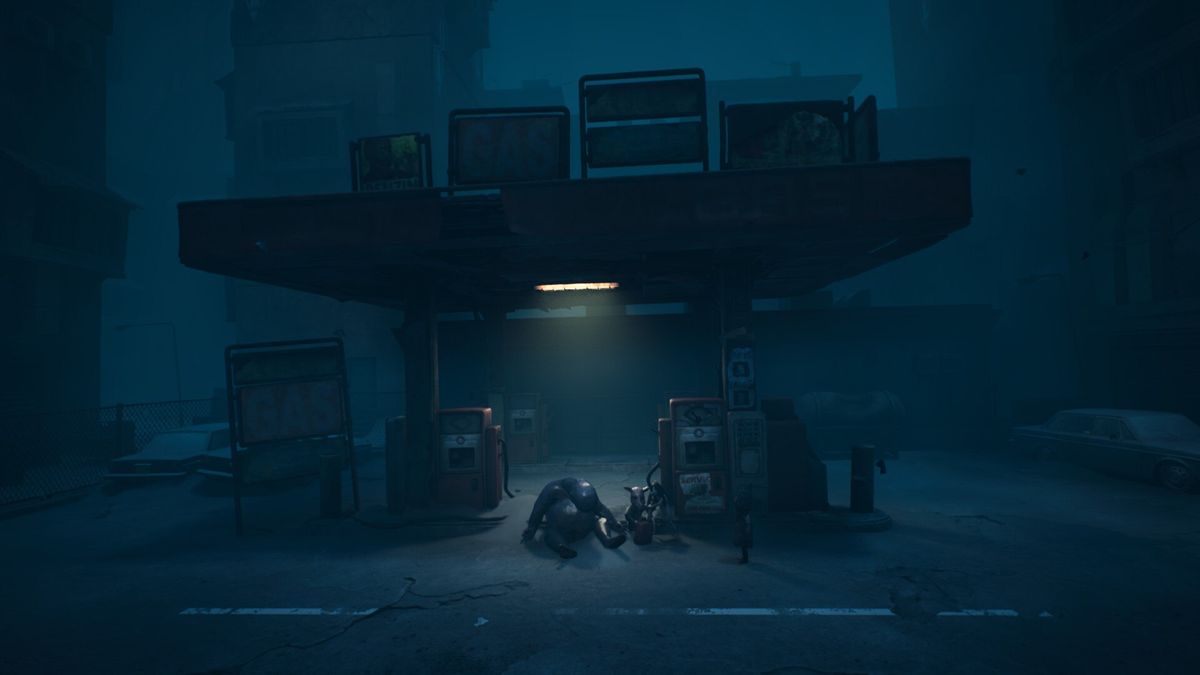 A ruined petrol station by night