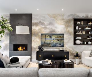 family living room with mural and cream sectional sofa with black accessories