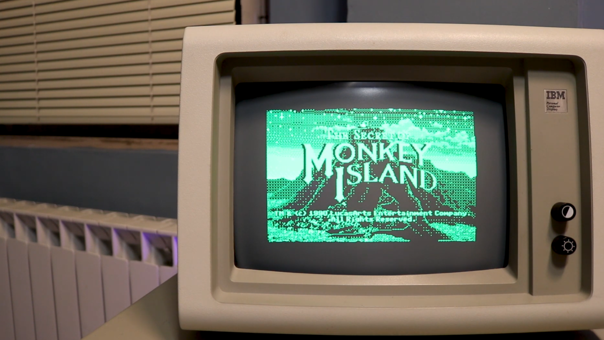 A retro IBM computer from the 1980s, playing The Secret of Monkey Island