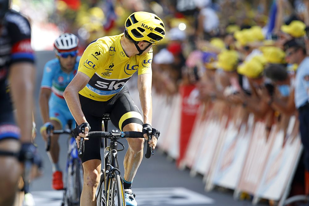 Chris Froome (Team Sky) looks back as he crosses the finish line in Rodez