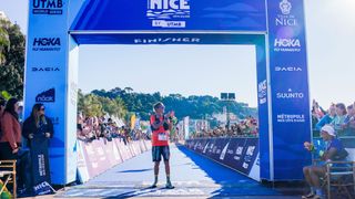 Courtney Dauwalter crossing the finish line at the UTMB Nice