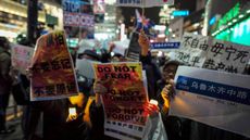 Chinese residents and supporters in Japan stage a protest 
