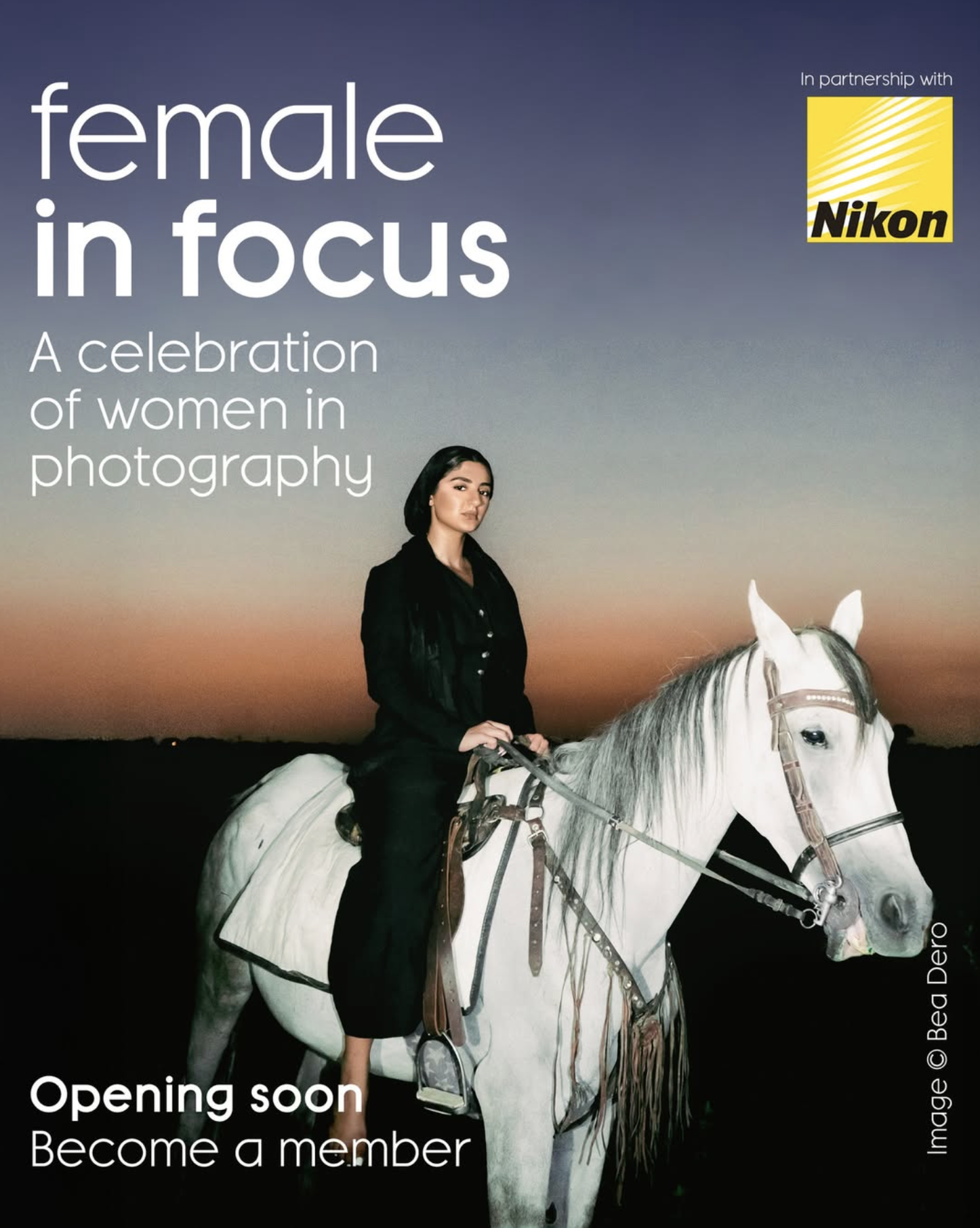 A woman in black attire sits confidently on a white horse against a twilight sky, promoting a photography initiative for women