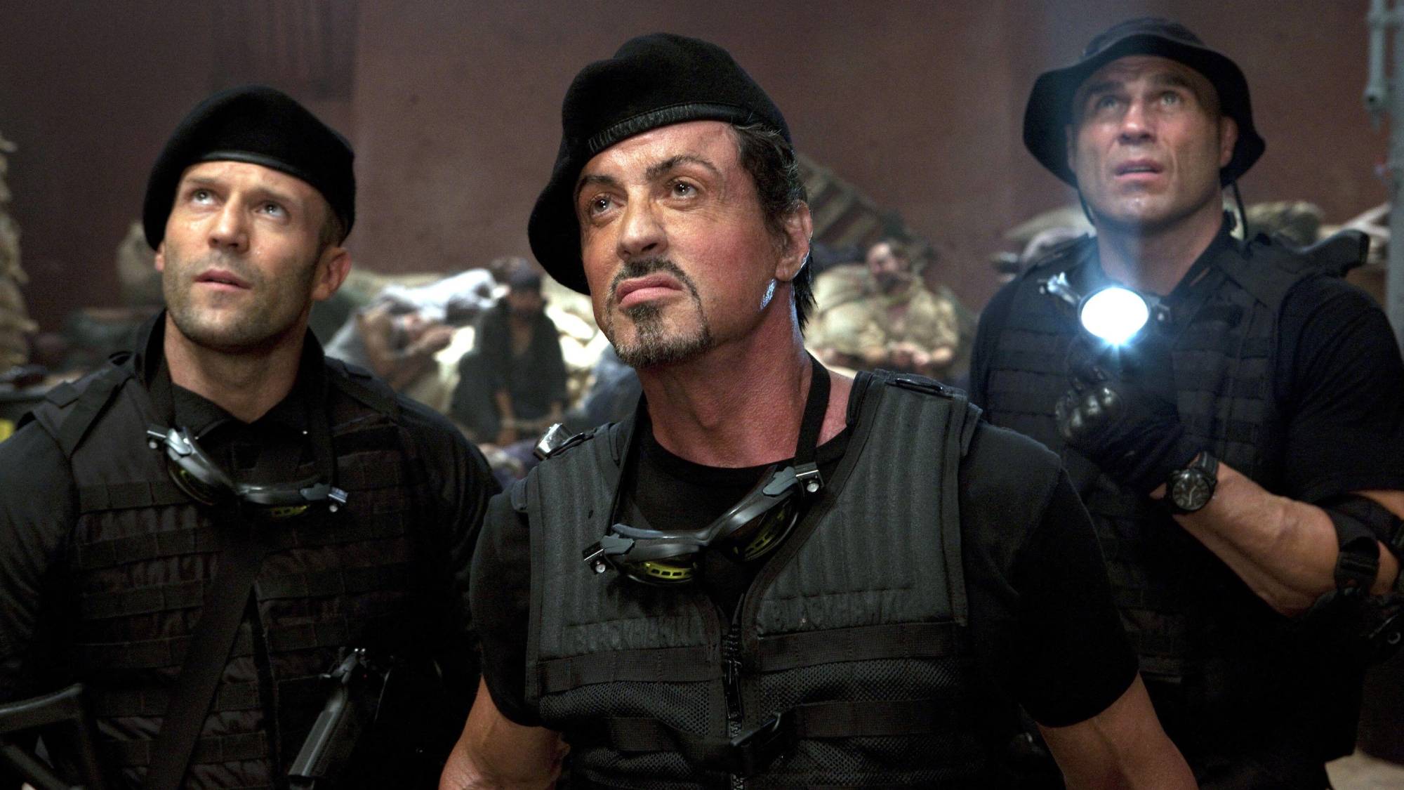 (L-R) Jason Statham as Lee Christmas, Sylvester Stallone as Barney Ross and Randy Couture as Toll Road in "The Expendables"